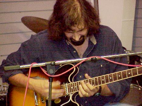 Chuck Yamek playing a Gibson ES335 on Superior Music souths' stage